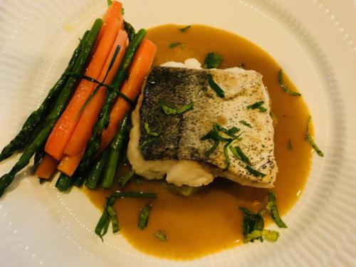 Main course - pan seared fish with curried veloute and carrot asparagus bundles
